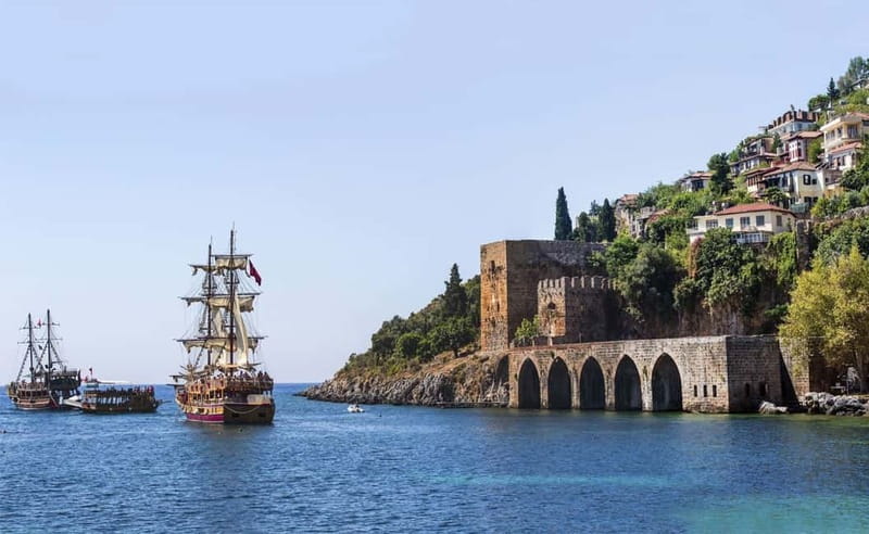 Alanya: Pirate Boat Trip with Meal, Drinks and Pickup Option - Boarding a pirate boat with practical facilities