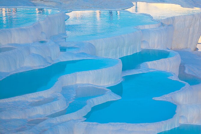Pamukkale and Hierapolis Daily Tour From Antalya - Hierapolis: ruins above the white terraces
